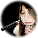 magnifying glass and praying girl